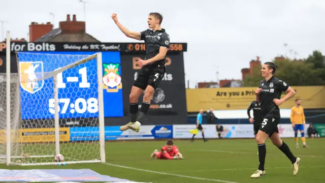 Max Cleworth celebrates putting Wrexham back in front at Mansfield