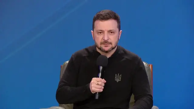 Zelensky speaking at a press conference