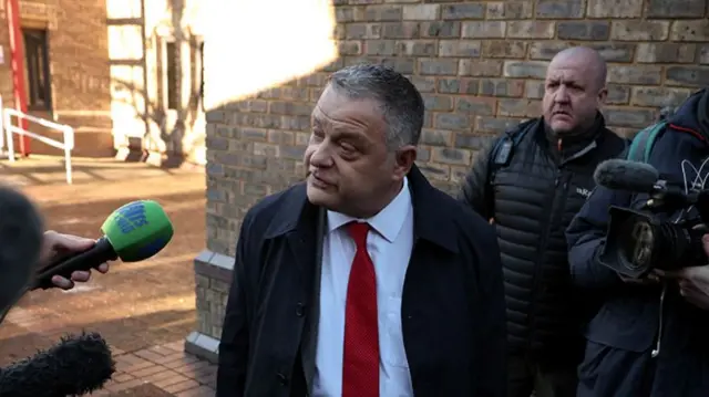 Mike Amesbury MP talking to reporters outside court