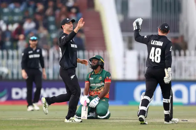 Tom Latham celebrates the run out of Jaker Ali