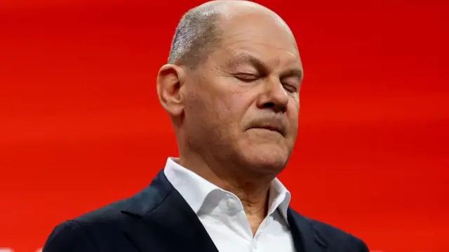 German Chancellor Olaf Scholz of the Social Democratic Party (SPD) reacts after the exit poll results are announced for the 2025 general election, in Berlin, Germany, February 23, 2025.