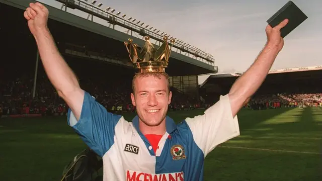 BLACKBURN ROVERS STRIKER ALAN SHEARER CELEBRATES AFTER HIS TEAM CLINCHED THE LEAGUE TITLE AFTER THE GAME AGAINST LIVERPOOL.