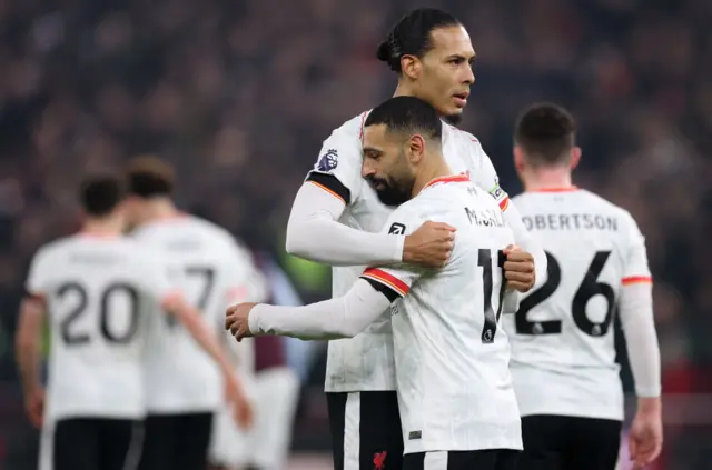 Liverpool's Mohamed Salah with teammate Virgil van Dijk