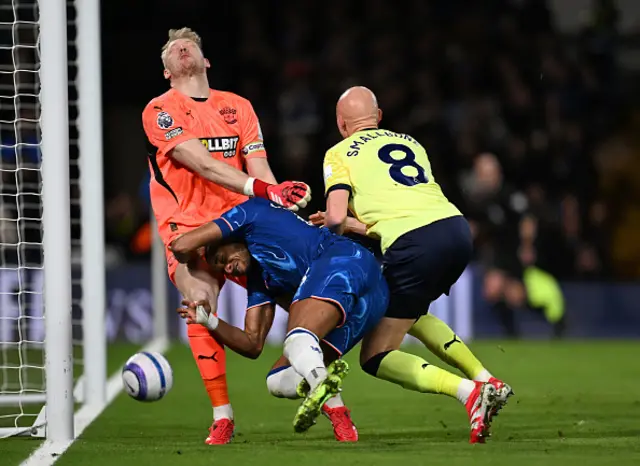 Christopher Nkunku of Chelsea scores his team's first goal past Aaron Ramsdale