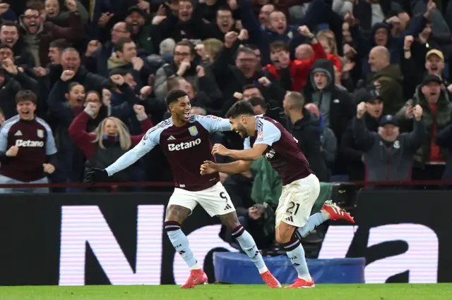 Marcus Rashford and Marco Asensio celebrating for Aston Villa