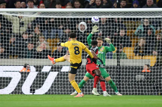 Joao Gomes of Wolverhampton Wanderers scores