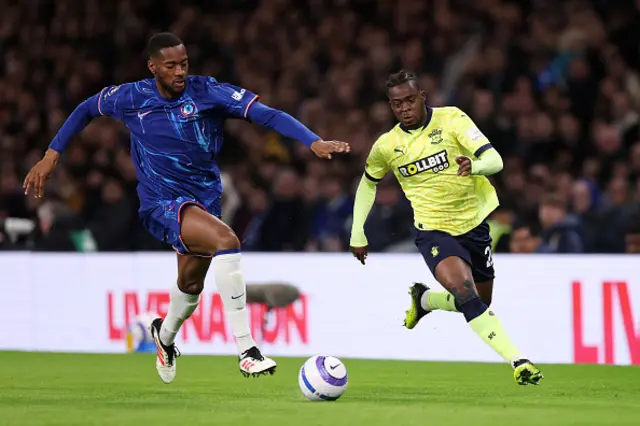 Tosin Adarabioyo of Chelsea battles for possession with Kamaldeen Sulemana