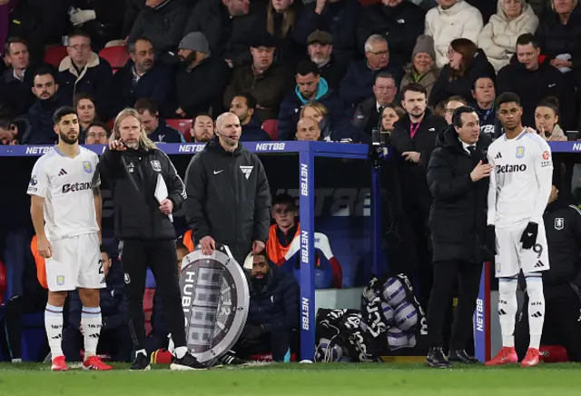 Marco Asensio and Marcus Rashford of Aston Villa receive instructions