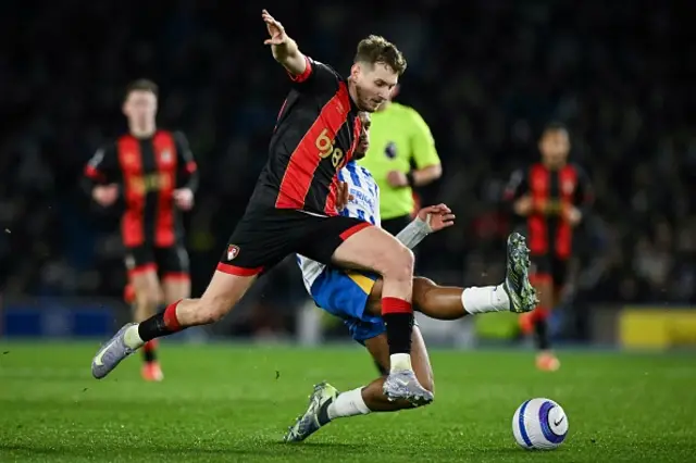 David Brooks (L) fights for the ball with Georginio Rutter