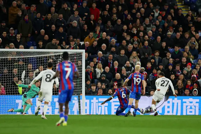 Morgan Rogers of Aston Villa scores a goal under pressure from Marc Guehi