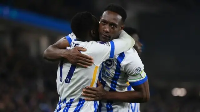 Yankuba Minteh of Brighton & Hove Albion (L) celebrates with team mate Danny Welbeck