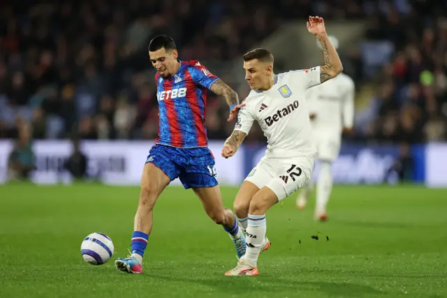 Daniel Munoz of Crystal Palace is challenged by Lucas Digne