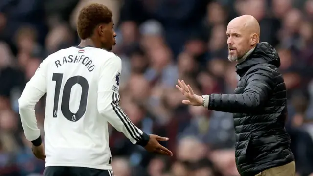 Erik ten Hag speaks with Marcus Rashford