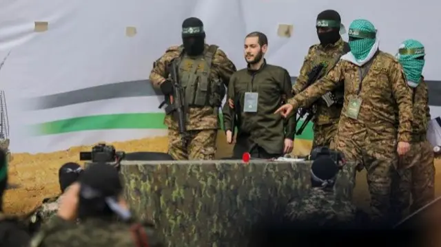 Hamas fighters accompany Israeli hostage Eliya Cohen