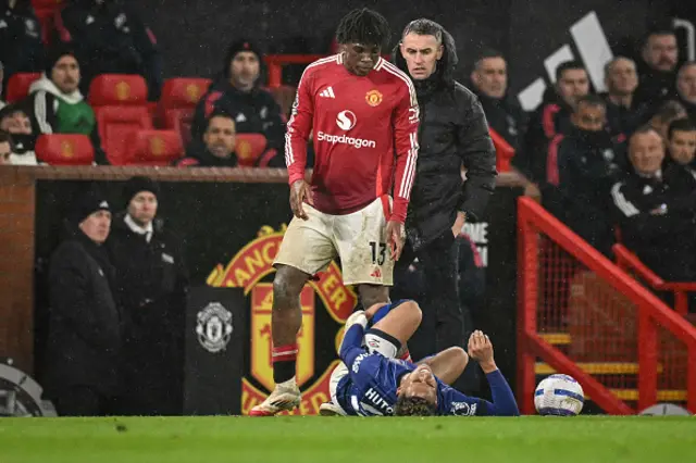 Patrick Dorgu (L) checks on Ipswich Town's Jamaican midfielder Omari Hutchinson