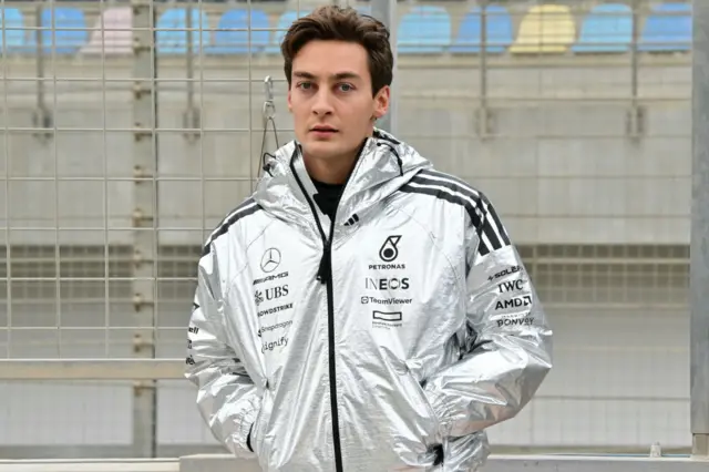 George Russell in his Silver Mercedes jacket