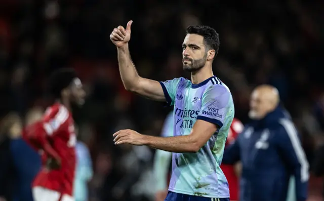 Arsenal's Mikel Merino acknowledges his side's travelling supporters