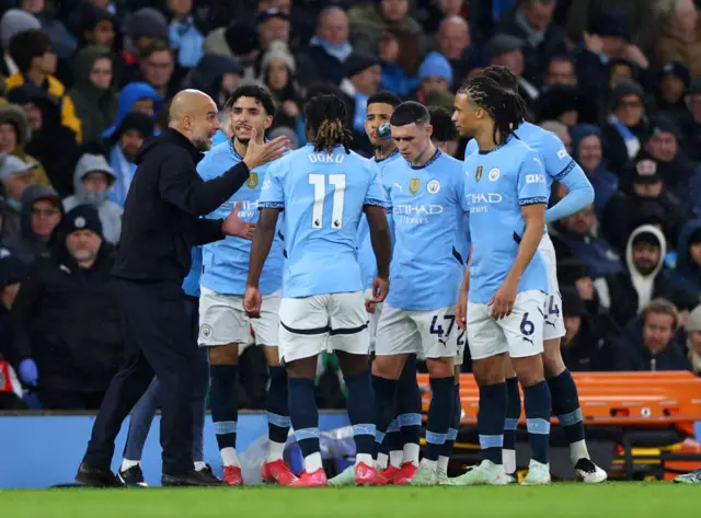 Pep Guardiola instructs his players during their defeat to Liverpool