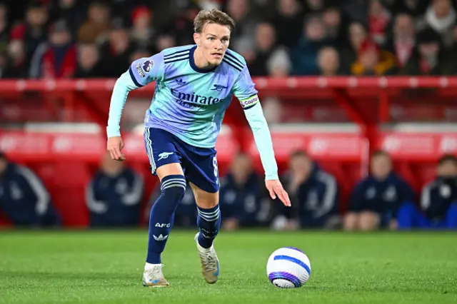 Martin Odegaard of Arsenal runs with the ball