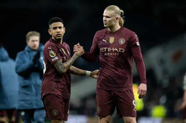 Savinho and Erling Haaland of Manchester City acknowledge each other