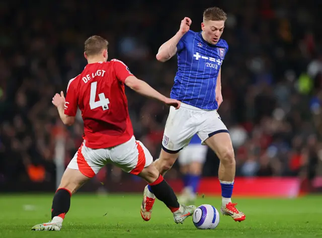 Liam Delap of Ipswich Town is challenged by Matthijs de Ligt