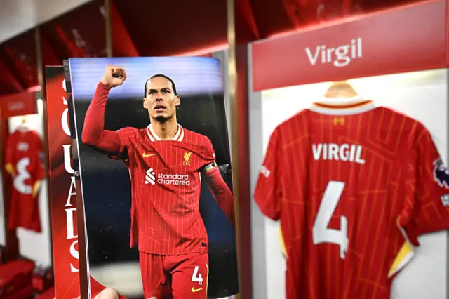 The match day program is displayed inside the Liverpool dressing room