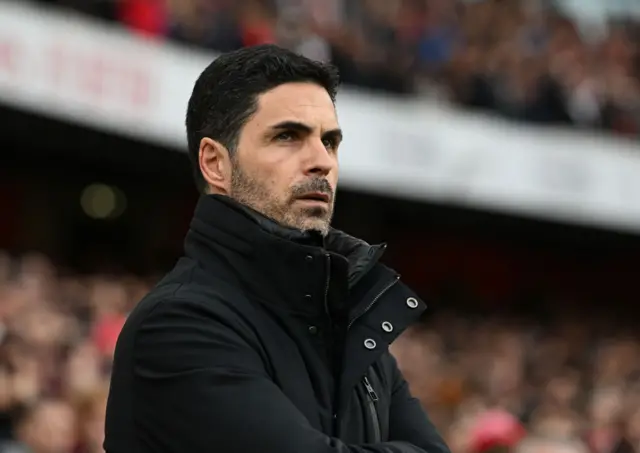 Mikel Arteta looks on
