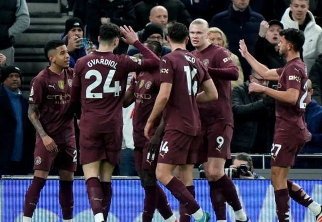 Manchester City's Erling Haaland (second right) is congratulated by his team mates