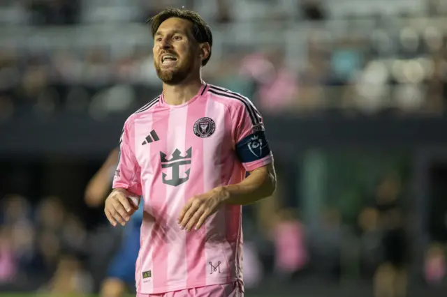 Lionel Messi looks on