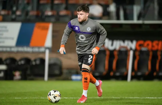 Ryan Strain warming up for Dundee United