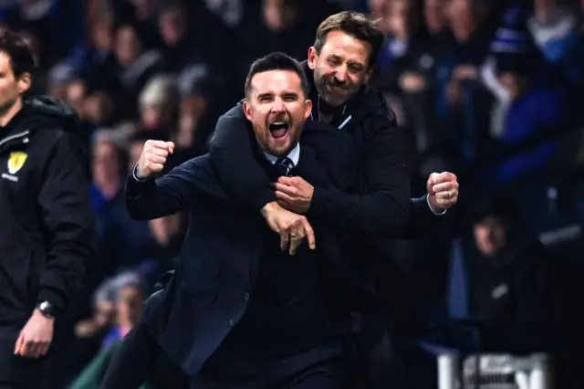 Barry Ferguson and Neil McCann celebrate on the touchline