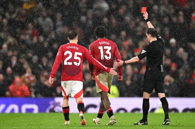 Referee Darren England shows a red card to Patrick Chinazaekpere Dorgu