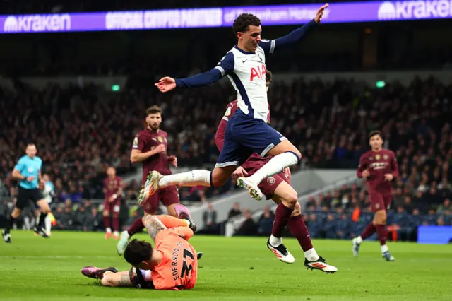 Ederson of Manchester City collects the ball under Brennan Johnson of Tottenham Hotspur