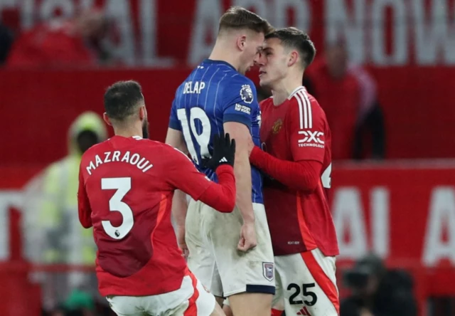 Ipswich Town's Liam Delap clashes with Manchester United's Noussair Mazraoui and Manuel Ugarte