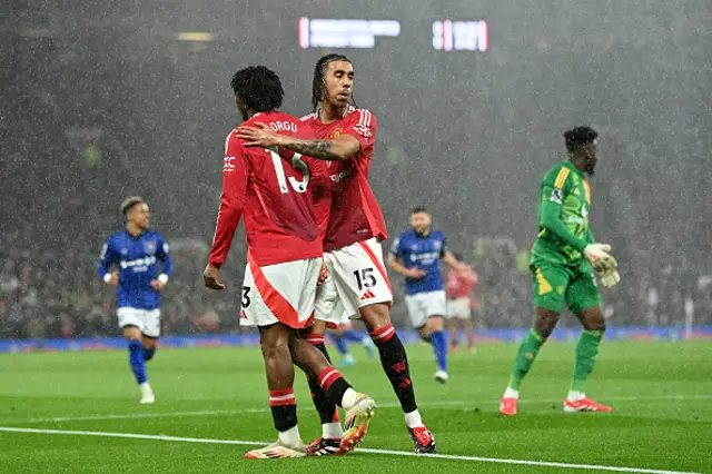 Leny Yoro of Manchester United (R) consoles teammate Patrick Chinazaekpere Dorgu