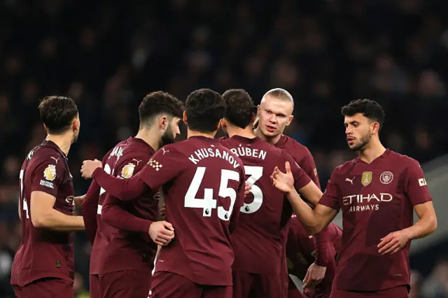 Erling Haaland and Matheus Nunes of Manchester City embrace their teammates