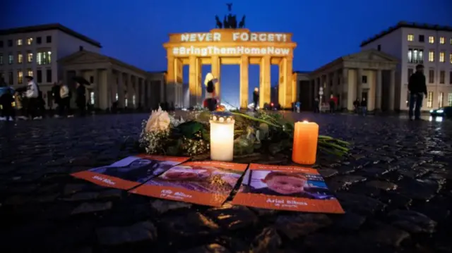 Berlin's Brandenberg gate illuminated in orange on Wednesday