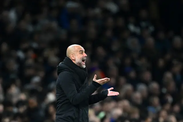 Pep Guardiola, Manager of Manchester City, reacts