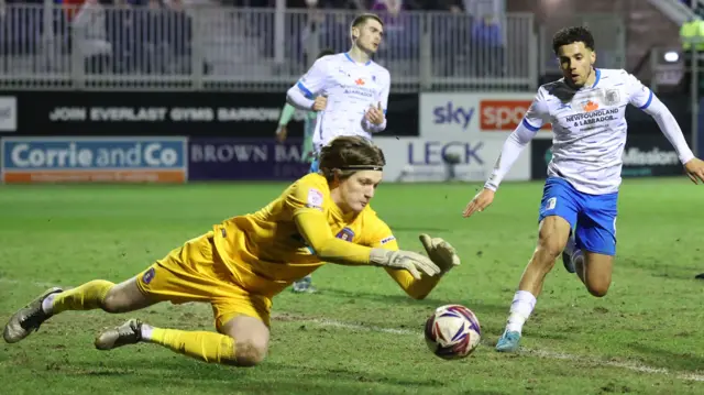 Gabe Breeze dives out to gather the ball