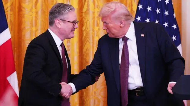 UK Prime Minister Keir Starmer and U.S. President Donald Trump shake hands at a joint press conference