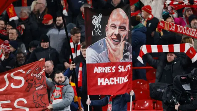 Arne Slot banner and Liverpool fans