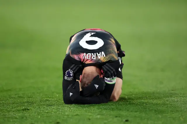 Jamie Vardy on the floor with his head in his hands