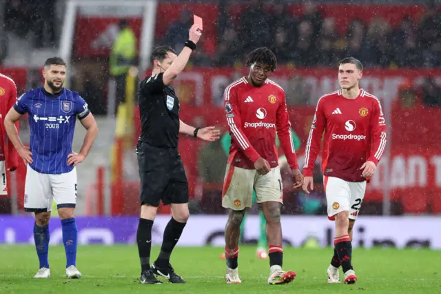 Patrick Dorgu being shown the red card against Ipswich