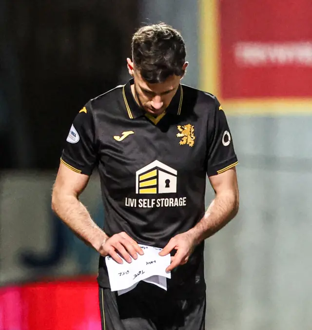 Ryan McGowan with a note from his manager with a new formation on it