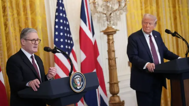 Starmer and Trump speak into microphones while hosting a news conference at the White House