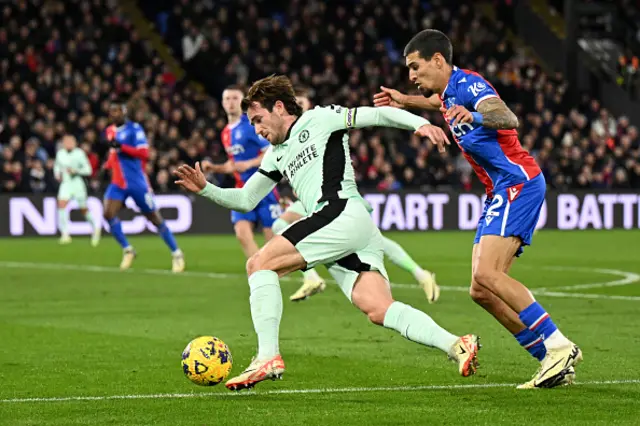 Ben Chilwell of Chelsea is challenged by Daniel Munoz