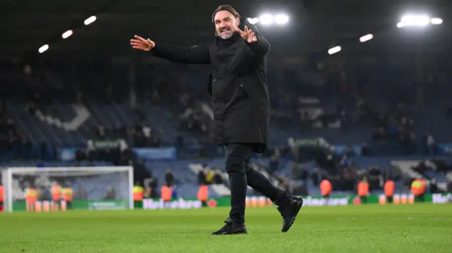 Leeds boss Daniel Farke celebrates with the fans after beating Cardiff 7-0