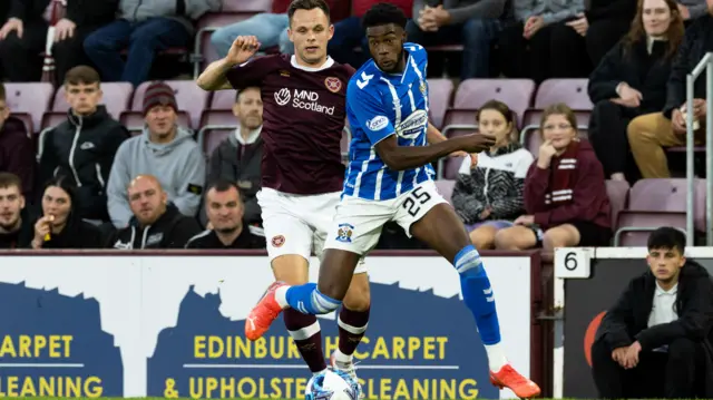 Kilmarnock's Ryan Alebiosu (R) and Hearts' Lawrence Shankland in action during a Premier Sports Cup match between Hearts and Kilmarnock at Tynecastle