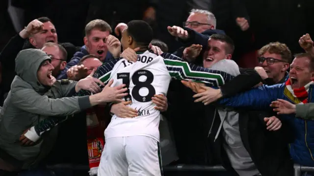 Wilson Isidor runs into a crowd of Sunderland fans to celebrate