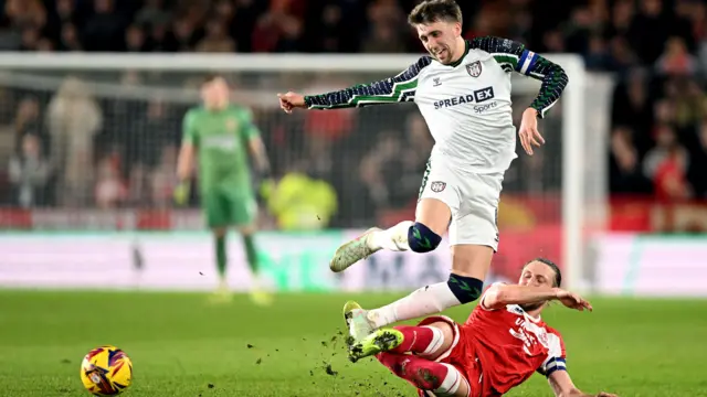 Middlesbrough's Luke Ayling slides in to tackle Sunderland's Dan Neil